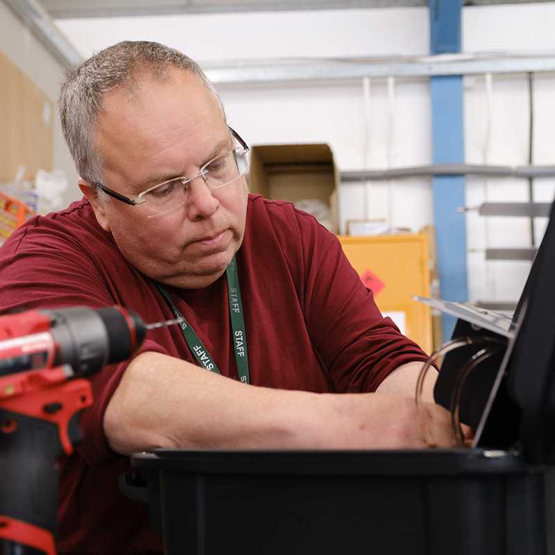 An engineer assembling components