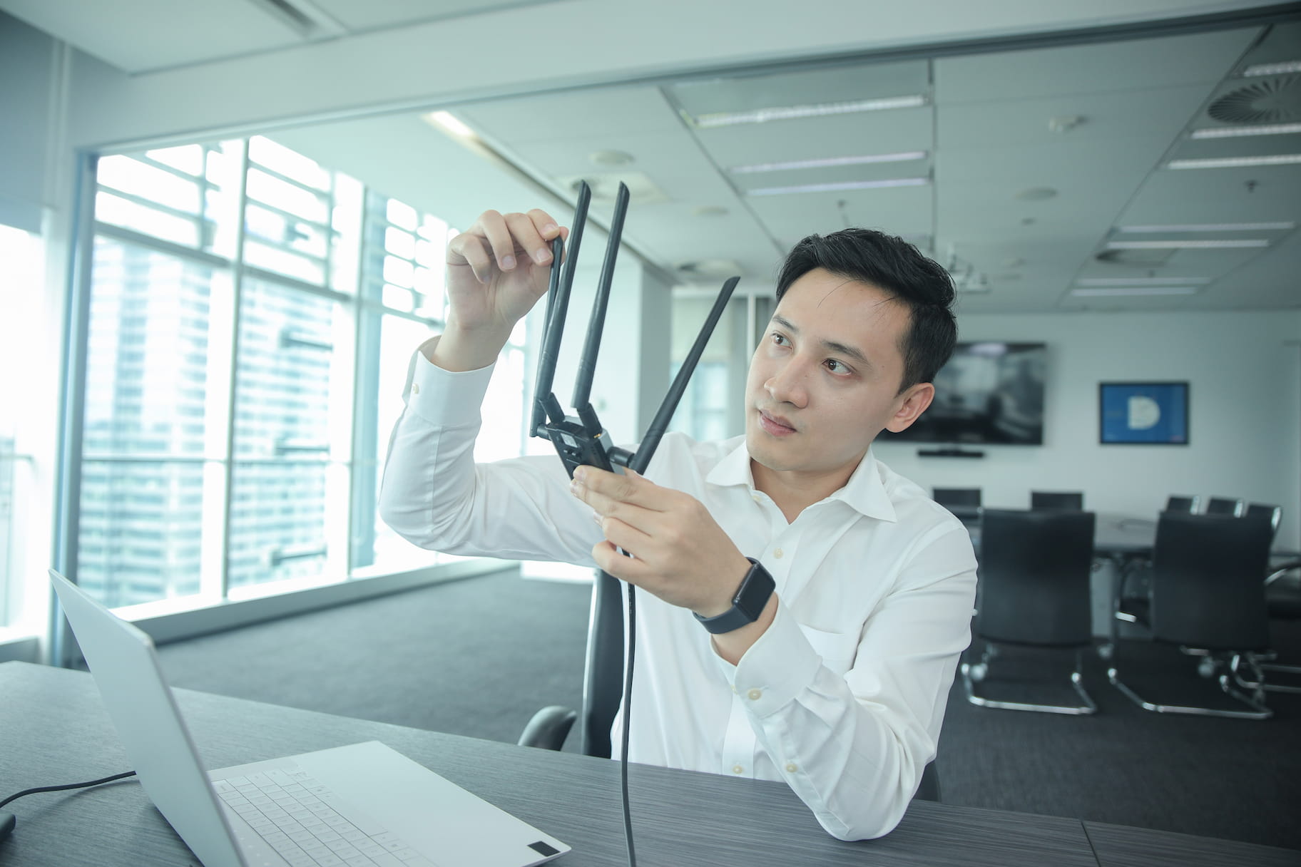 Young man adjusting sensor