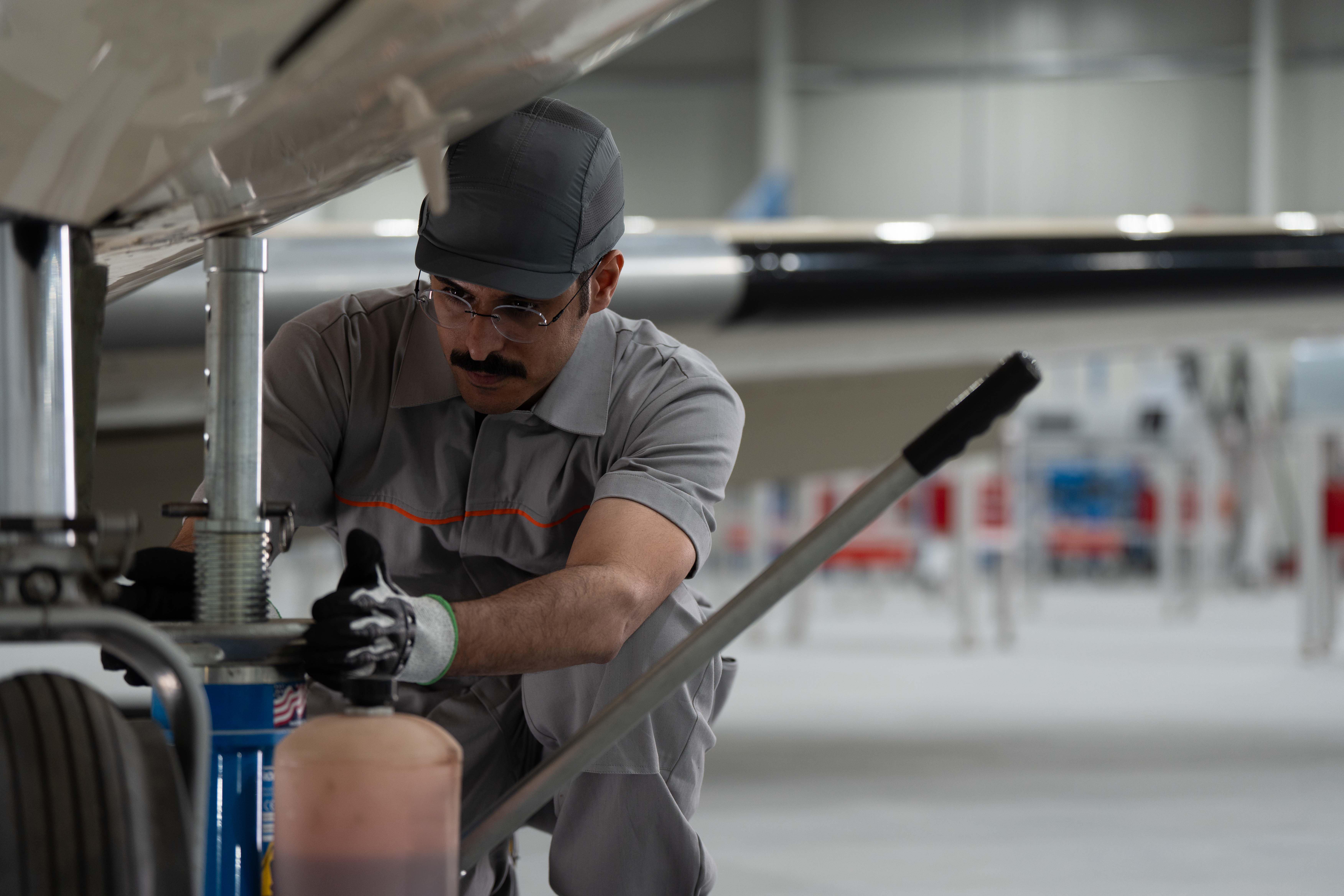 Air crewman adjust plane wheels