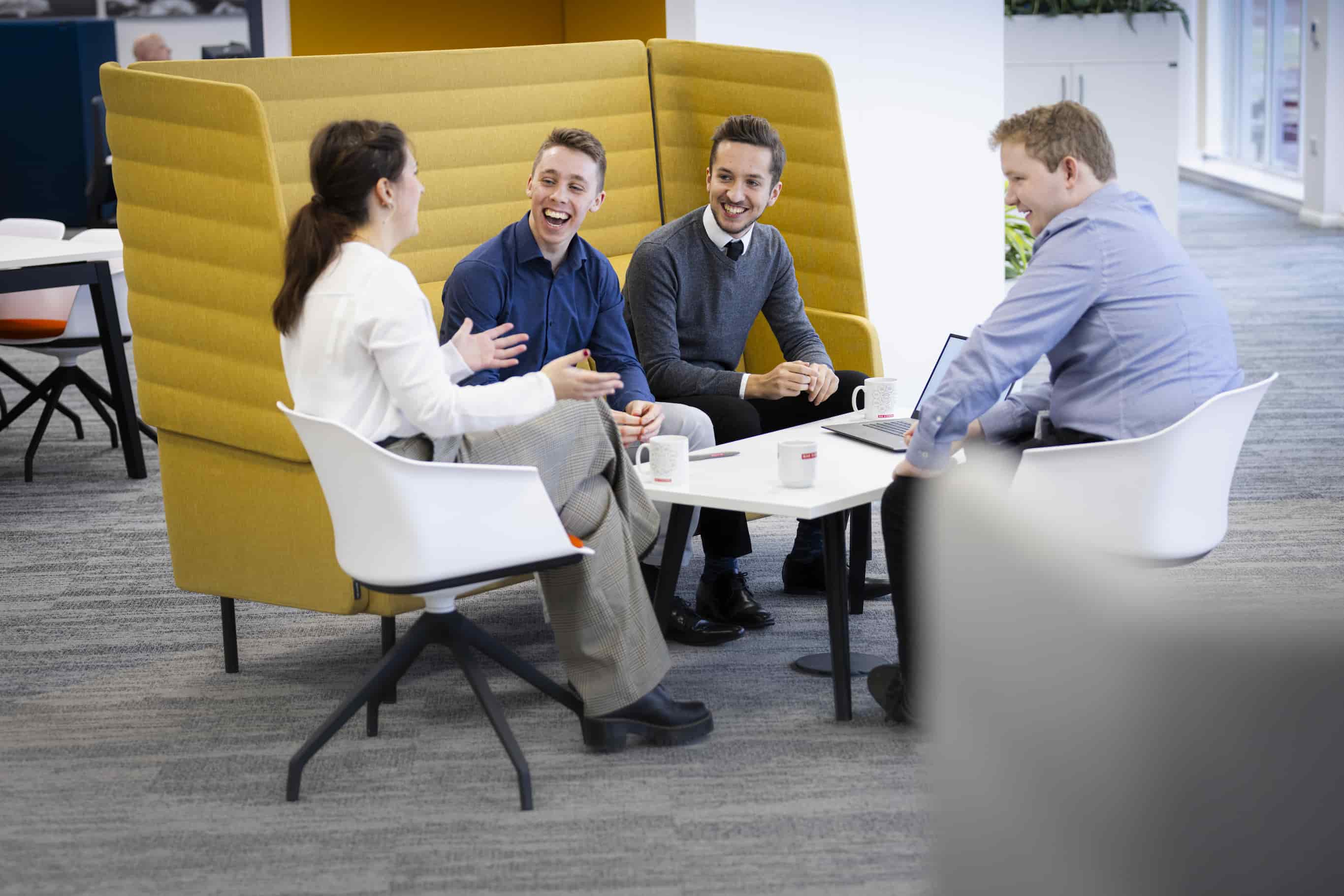 Four marketing colleagues having a meeting at BAE Systems