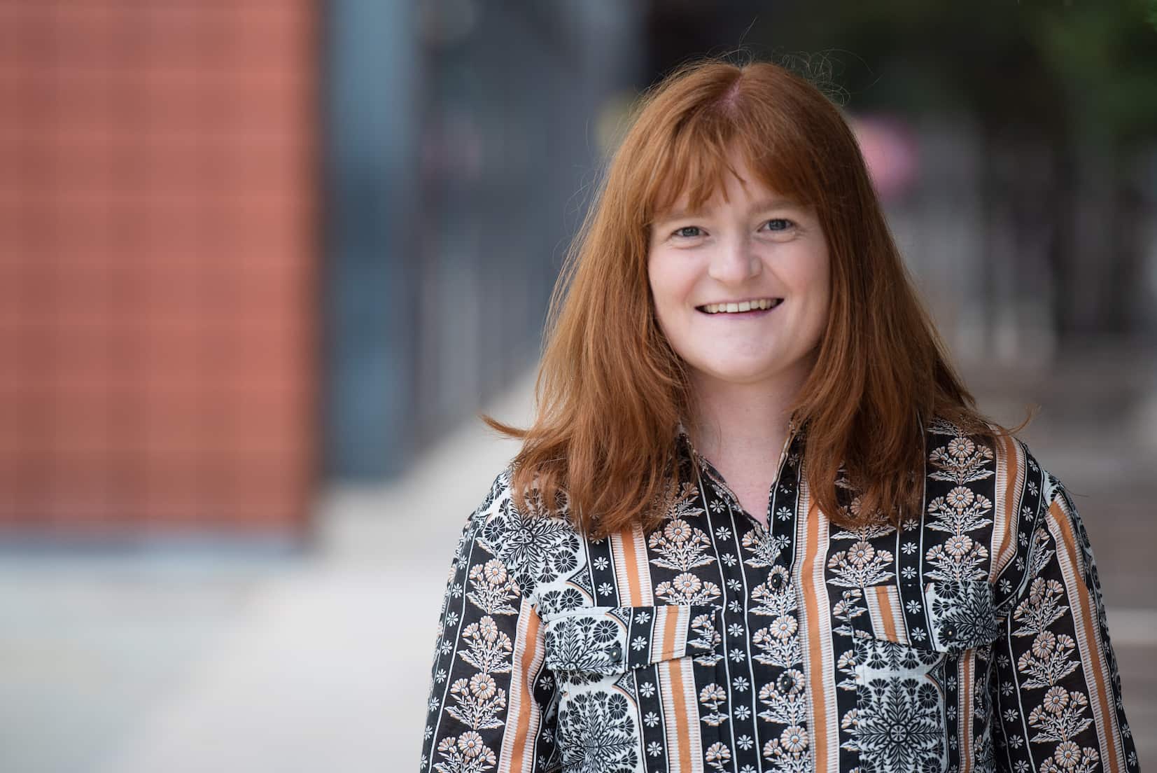woman smiling in urban area